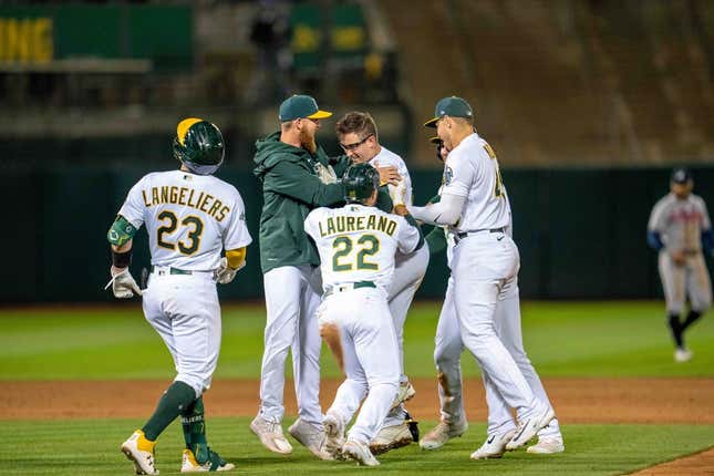 May 30, 2023; Oakland, CA, USA; Oakland Athletics third baseman Jonah Bride (26) and designated hitter Ramon Laureano (22) and catcher Shea Langeliers (23) Atlanta Braves postgame celebration (at the Alameda County Coliseum in Oakland.